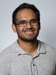 Headshot of Dr Sam Adhikary
