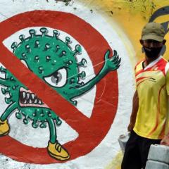 A mural of health protocol against COVID-19 spread in Indonesia. Arif Firmansyah/Antara Foto