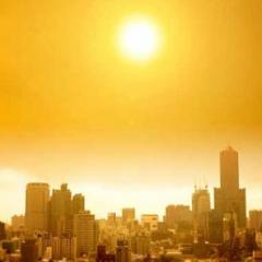 Sun setting over city skyline