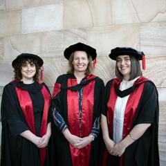 Hollie, Sheleigh and Ally in gowns at graduation