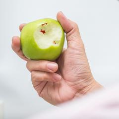Bite make with blood left behind on apple