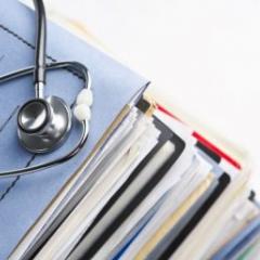 Stethoscope on stack of files