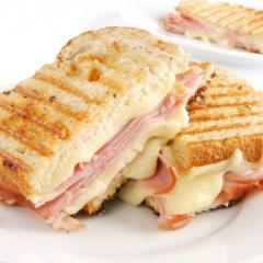 Toasted ham and cheese sandwich on plate